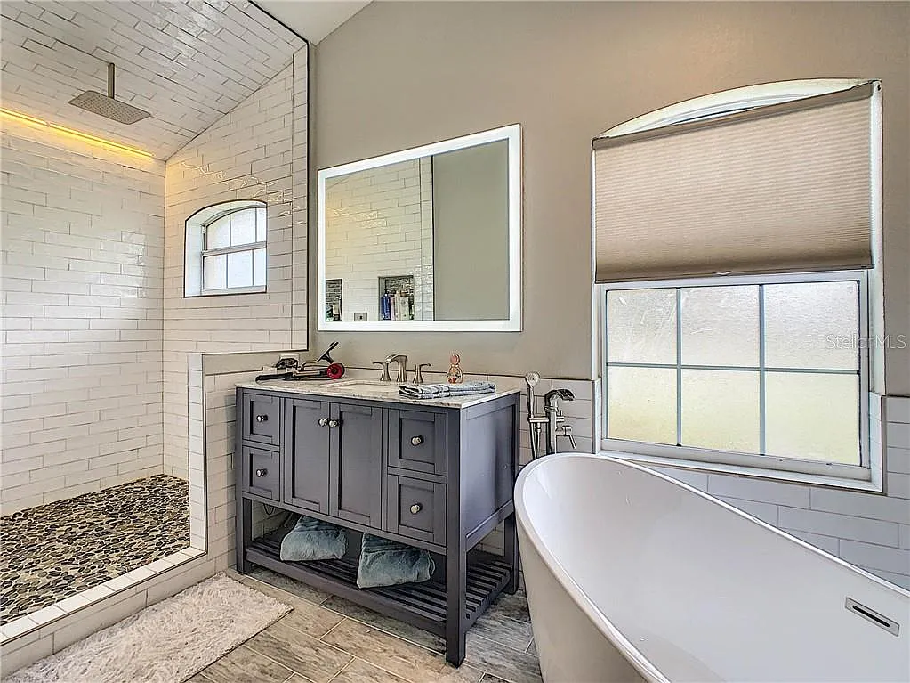 Primary bathroom shower and tub